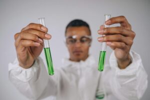 a man holding test tubes